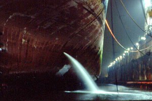 Ballast water release in dock at night - Stephan Gollasch